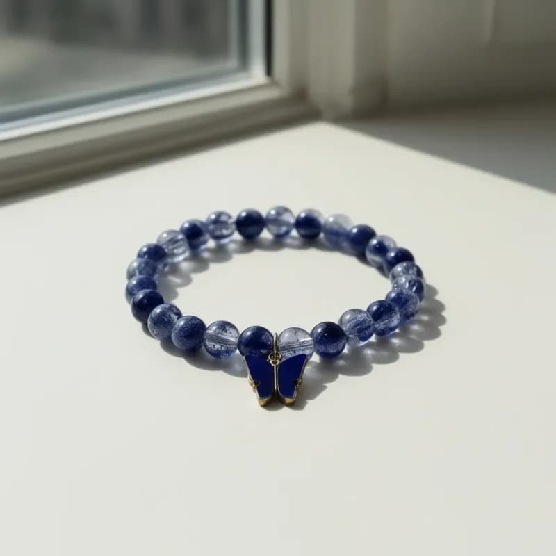 Blue Beaded Bracelet with Butterfly Charm - Image 1